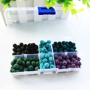 Detailed view of colorful volcanic lava stone beads in a 6-compartment storage box