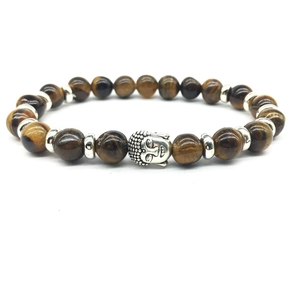 Tiger Eye stone bead bracelet with a silver Buddha head charm on a white background
