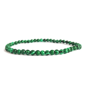 Natural malachite beaded bracelet with 4mm green stones and elastic cord on white background
