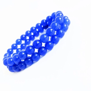 Blue chalcedony bead bracelet with double-layer design and polished finish on white backdrop