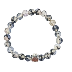 Natural dendritic agate beaded bracelet with a silver paw print charm on white background