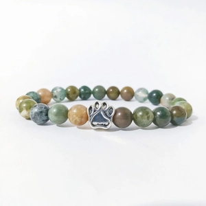 Detail of beaded bracelet with natural stone beads and silver cat paw charm