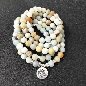 Frosted amazonite 108 beads wrap bracelet with a lotus flower pendant on black background