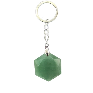 Macro detail of green aventurine stone keychain with geometric faceted cut and silver ring