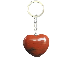 Detail of red jasper heart-shaped pendant with a silver metallic keychain ring