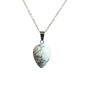 Minimalist white howlite water drop pendant necklace with silver chain on white background