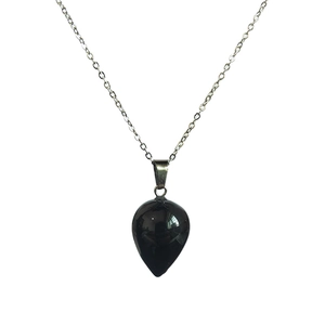 Detailed view of polished teardrop black stone pendant with slim silver link chain