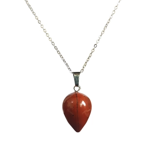 Macro shot of red jasper teardrop pendant with silver chain on white background