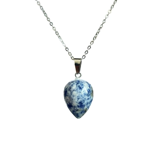 Detailed close-up of water-drop shape gemstone pendant with silver O-chain necklace