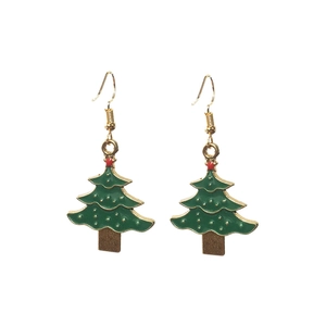 Close-up of gold-plated Christmas tree drop earrings with green enamel and red accents