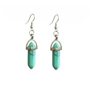 Detail of hexagon mint green stone earrings with black marble pattern and silver hooks