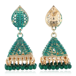 Bohemian gold jhumka drop earrings with green enamel and beaded tassels on white background