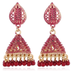 Detailed view of pink enamel bell earrings with gold accents and red beads for a boho look