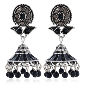 Detailed close-up of Bohemian Jhumka earrings with silver metal and black enamel beads