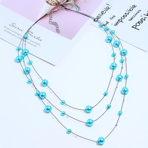 Detailed view of the triple-layer light blue pearl necklace with adjustable lobster clasp
