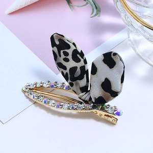 Détails de la pince à cheveux en strass avec nœud léopard et cristaux colorés