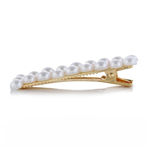 Barrette à cheveux dorée avec double rangée de perles et design antidérapant
