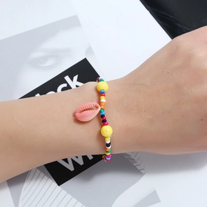 Handmade colorful seed bead bracelet with pink shell pendant and yellow beads for kids