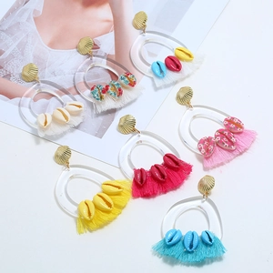 Bohemian tassel earrings with acrylic rings, gold shells and multi-color fringe details