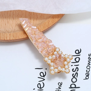 Pink crystal hair clip with star pearl decoration on elegant display card