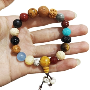 Bracciale tradizionale Bodhi diciotto semi con perle naturali miste e nappa
