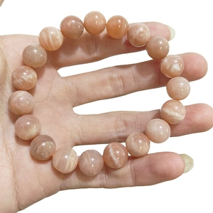Natural orange sunstone beaded bracelet with shimmering silk luster for men and women