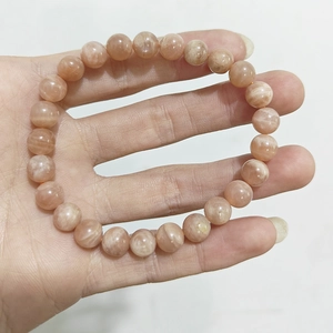Natural orange sunstone beaded bracelet for women and men featuring round moonstone gems