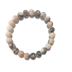 Pink zebra stone and white turquoise beaded couple bracelet with heart charm on white background