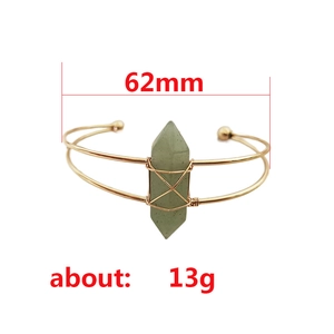 Handmade gold wire-wrapped bangle with a green hexagonal crystal stone, 62mm diameter