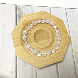 Bracelet en cristal blanc naturel avec des perles rondes translucides et des fissures de glace