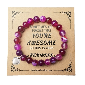 Purple striped agate beaded bracelet with heart pendant on inspirational message card
