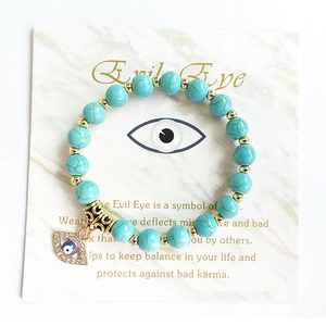 Böhmisches Evil Eye Armband mit goldfarbenen Perlen und türkisfarbenen Steinen für Damen