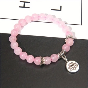 Rosa Zebra-Kristall Lotus-Charm-Armband mit silbernen Perlen auf elastischem Band