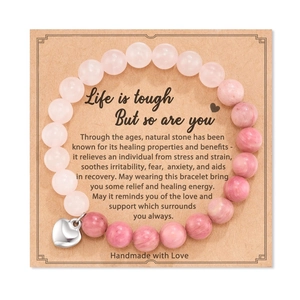 Detail of 8mm pink zebra stone beads with polished silver heart pendant on gift card