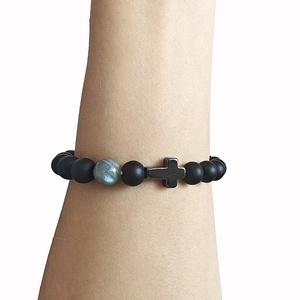 Matte black beaded bracelet with metal cross charm and moonstone accent for unisex