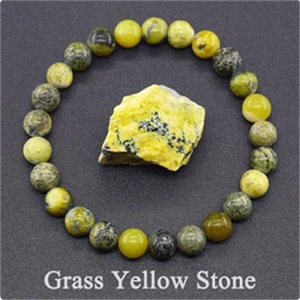 Detail of 8mm grass yellow stone beaded bracelet with matching raw mineral crystal stone