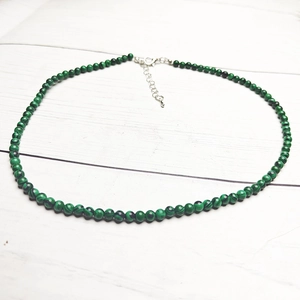 Detail of 4mm green malachite bead necklace with silver lobster clasp and extension chain