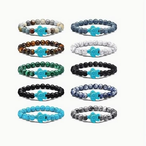 Set of 10 bohemian beaded bracelets with turtle pendants in diverse natural stones