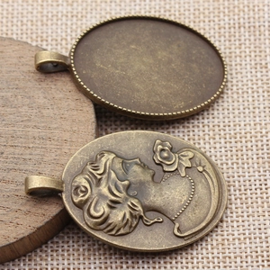 Oval 30x40mm vintage bronze pendant base with detailed cameo flower relief jewelry setting