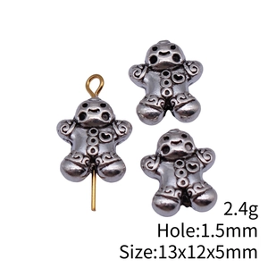 Three gingerbread man beads in vintage silver finish with gold pin, 13x12x5mm size