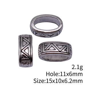 Antique silver oval spacer bead with geometric triangle pattern in multiple views