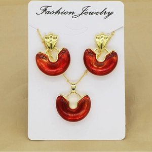 Vintage geometric necklace and earrings set with red resin and gold alloy frames