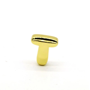 Detailed macro view of 3D gold-plated bubble letter T pendant with shiny polished finish