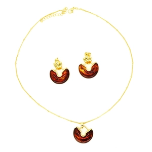 Vintage gold and amber resin heart jewelry set including a necklace and earrings