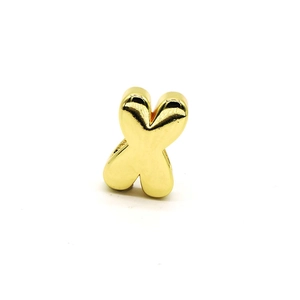 Close-up of polished gold-plated 3D letter X charm with a smooth mirror finish