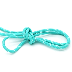 Close-up of mint green braided rope with white dotted texture and a compact knot