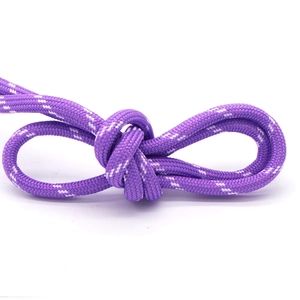 Detail of purple woven rope bracelet featuring white dots and flexible knot design