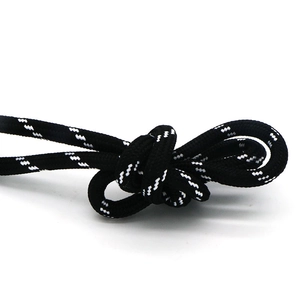 Detailed close-up of a black and white woven braided cord with a durable knotted texture
