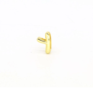 Close-up of polished gold-plated letter Y charm bead for DIY personalized jewelry making