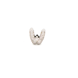 Macro shot of silver letter W charm with micro-pave cubic zirconia on white background